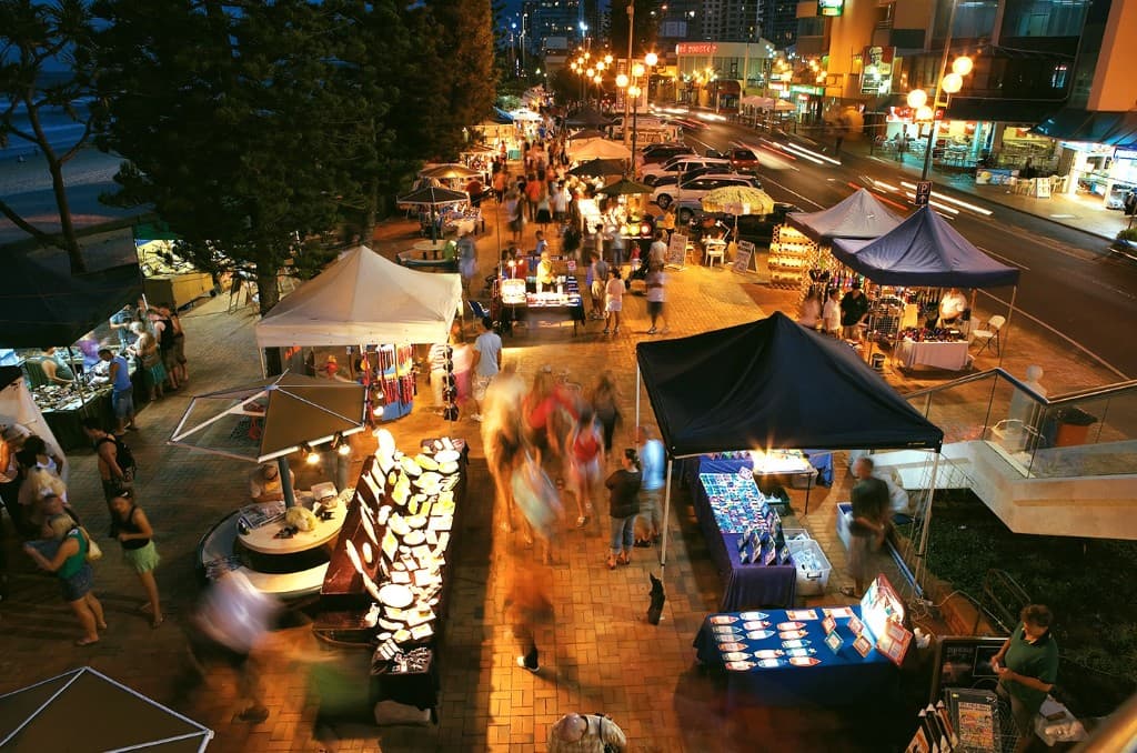Night market stalls along a beachfront promenade at Surfers Paradise
