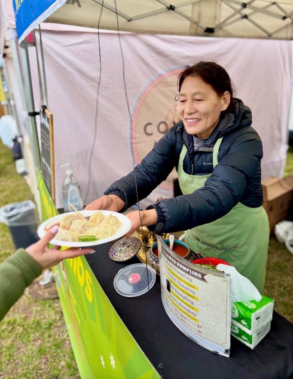 Local food producers and shoppers at an outdoor market